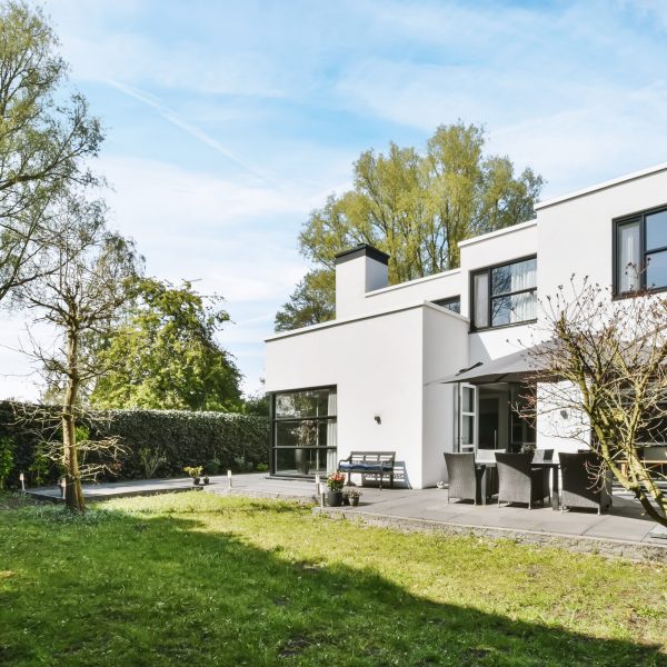 The courtyard of the house in a minimalist style with a lawn